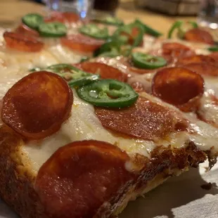 Pizza with pepperoni &amp; jalapeños