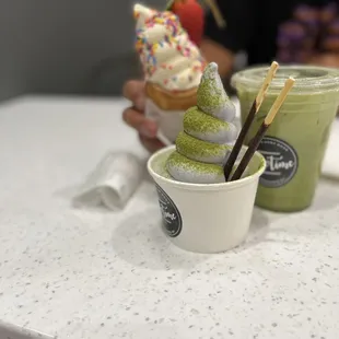 fish cone, cup of soft serve(taro w/matcha powder+ pocky, matcha latte