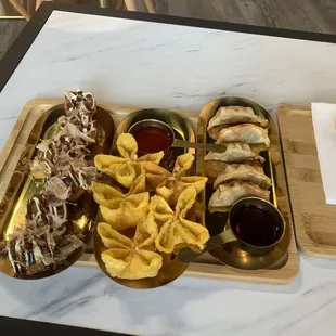 Takoyaki, crab rangoon, and gyoza