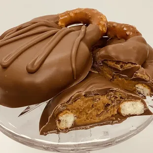 a chocolate covered doughnut with a bite taken out of it