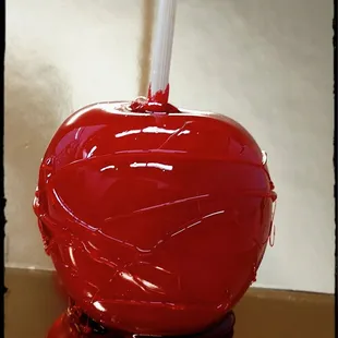 a red apple covered in chocolate