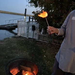 Hubby roasting marshmallows in the back of our cottage