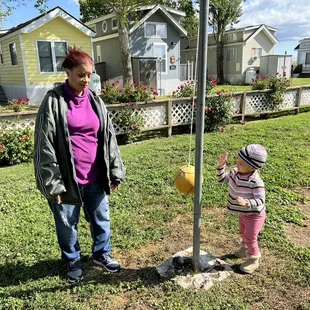 My daughter playing tether ball with her grandma