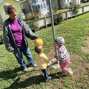 My babies playing tetherball with their grandma in the kids play area of the camp