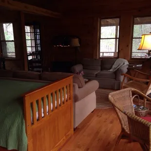 The extra bed and the living room area of the Cabin by the Creek