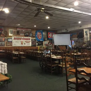 More of the interior, plenty of table room, a small movie screen in the back.