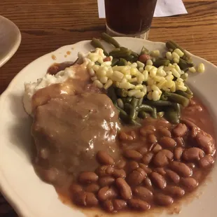 A fully loaded plate - mashed potatoes buried under the CS Steak, gren beans &amp; corn, and pintos!
