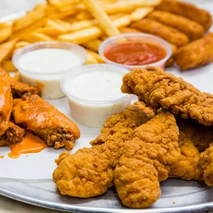 a plate of fried chicken and fries