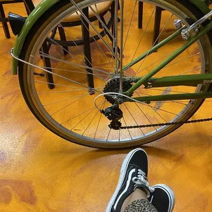 a person&apos;s legs and a bicycle