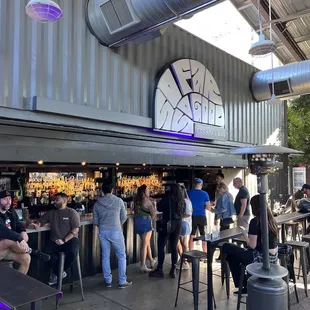 a group of people at a bar