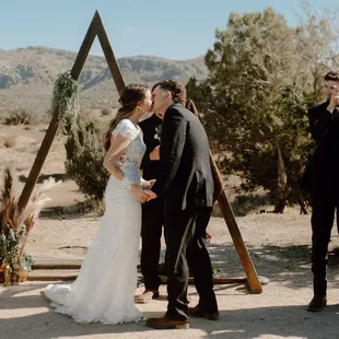 bride and groom first kiss