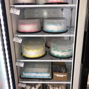 a refrigerator full of cakes