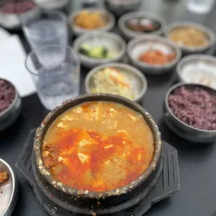 Combo soft tofu soup, banchan, purple mixed rice