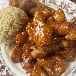 Spicy sesame chicken combination platter with fried rice and egg roll
