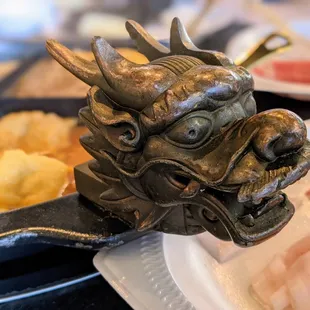 The hot pots here have cool dragon head handles.