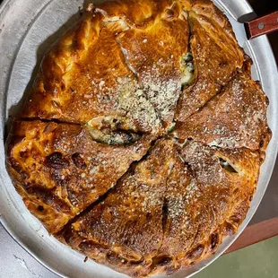 a pizza in a pan on a table