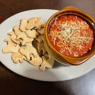 a bowl of soup and crackers