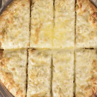 a cheese pizza cut into eight slices