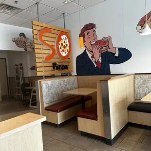 a man eating a slice of pizza