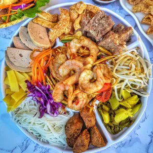 Thum Saap platter 
-papaya add shrimp or raw crab, meatball,Asian ham,pickle, Kapoon noodle, bamboo, pork rinds,bean sprouts, eggs, som moo