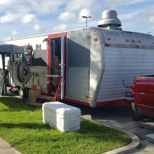 a red truck parked in a parking lot