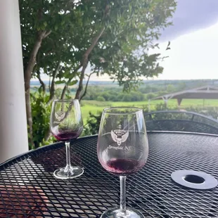 two glasses of wine on a table