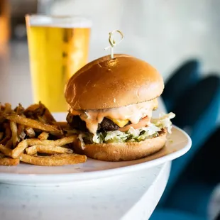 a hamburger and fries on a plate