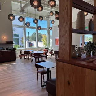 a dining area with tables and chairs