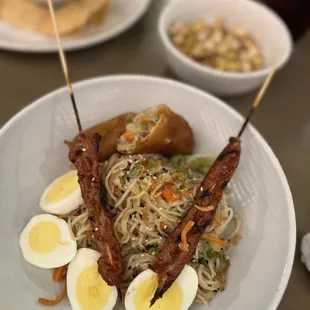 Amazing popcorn, Lola Bowl with filipino bbq pork skewers, egg roll, noodles, boiled egg