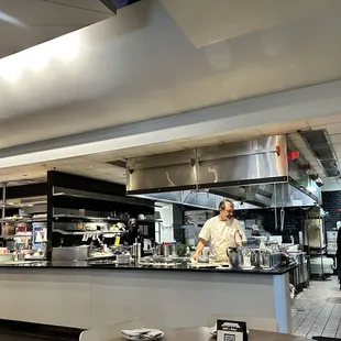 Open air kitchen viewable to all seating