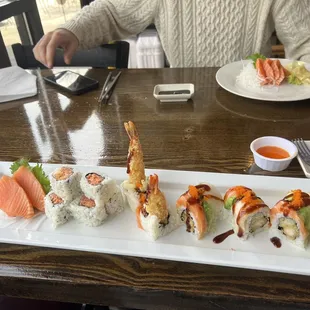 From left to right- salmon sashimi, spicy tuna roll, and the sky roll