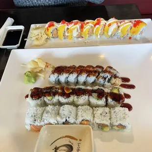 Ebi roll, eel avocado roll, Alaska roll, and special roll on top