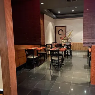 a restaurant with tables and chairs