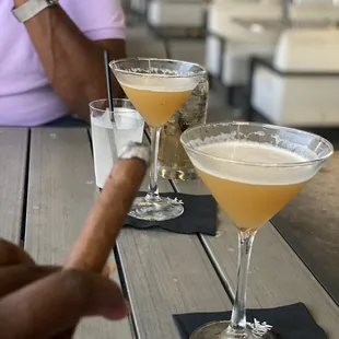 two cocktails on a table
