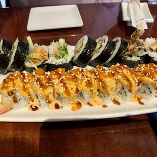 a platter of sushi and shrimp