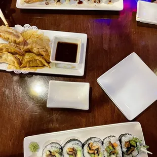 a variety of sushi dishes on a table