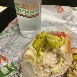 a sub sandwich with pickles