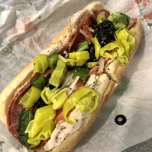 a hot dog with various toppings