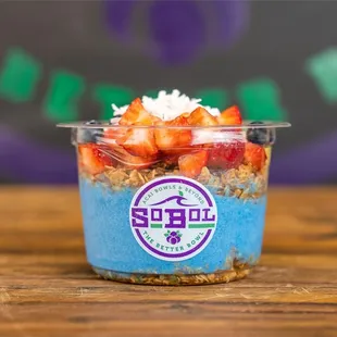 a yogurt with strawberries and granola
