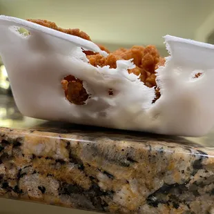 They use styrofoam for takeout, but they put the food in so hot that it metls into the styrofoam.