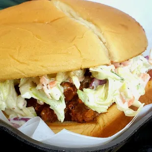 a pulled pork sandwich with coleslaw
