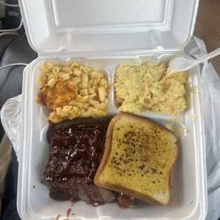 Plate with mac and cheese and potato salad