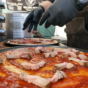 a chef preparing a pizza