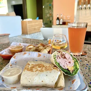 Turkey wrap, pretzels w/ beer cheese, pomegranate beer, apple brandy ‍
