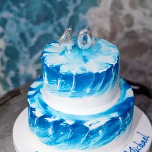 a blue and white birthday cake