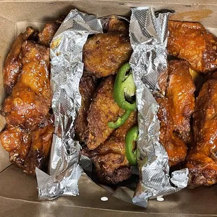 Spicy garlic Buffalo, house special and honey garlic sriracha wings