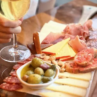 CAMPERO BOARD jamón serrano, chorizo &amp; salchichón Ibérico, manchego, idiazábal &amp; mahón cheese, marcona almonds, olives, membrillo