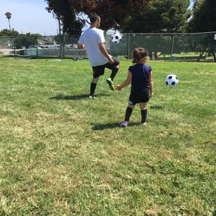 Coach Christian and Lulu playing and having fun on the field.  Age 3. First day of her 8 week personalized course and she did amazing!