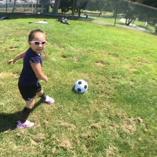 Lulu, Age 3, first day on the soccer field. Having fun with coach Christian!