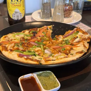 Their pizzas are great... They're on a bread crust, dislike a dense naan bread